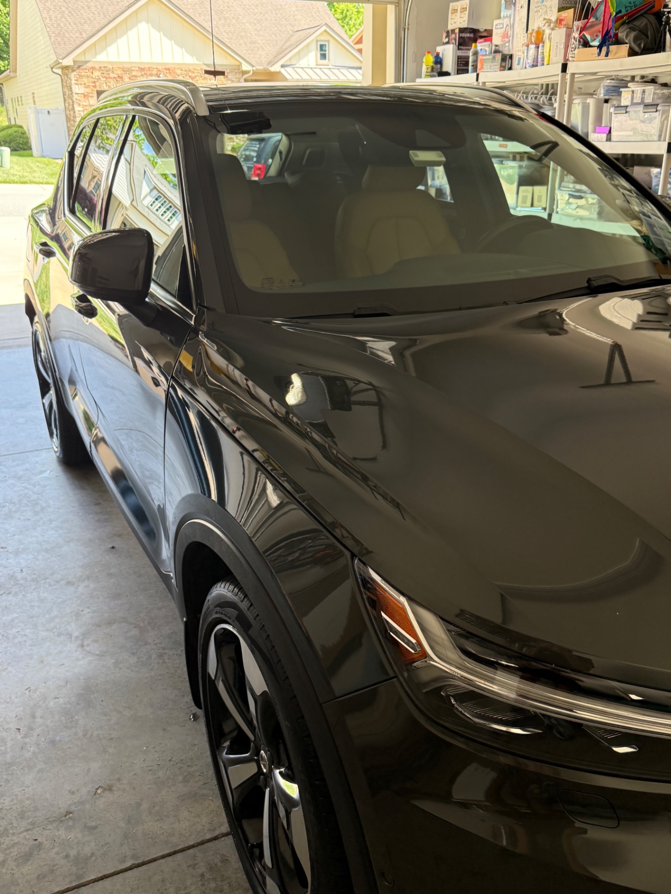 Volvo SUV with freshly detailed exterior finish in a garage